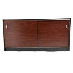 Shop display cabinet counter, glazed front and top, with mahogany laminate sides and back, enclosing two long adjustable shelves, fitted with two sliding cupboard doors to the rear, on castors