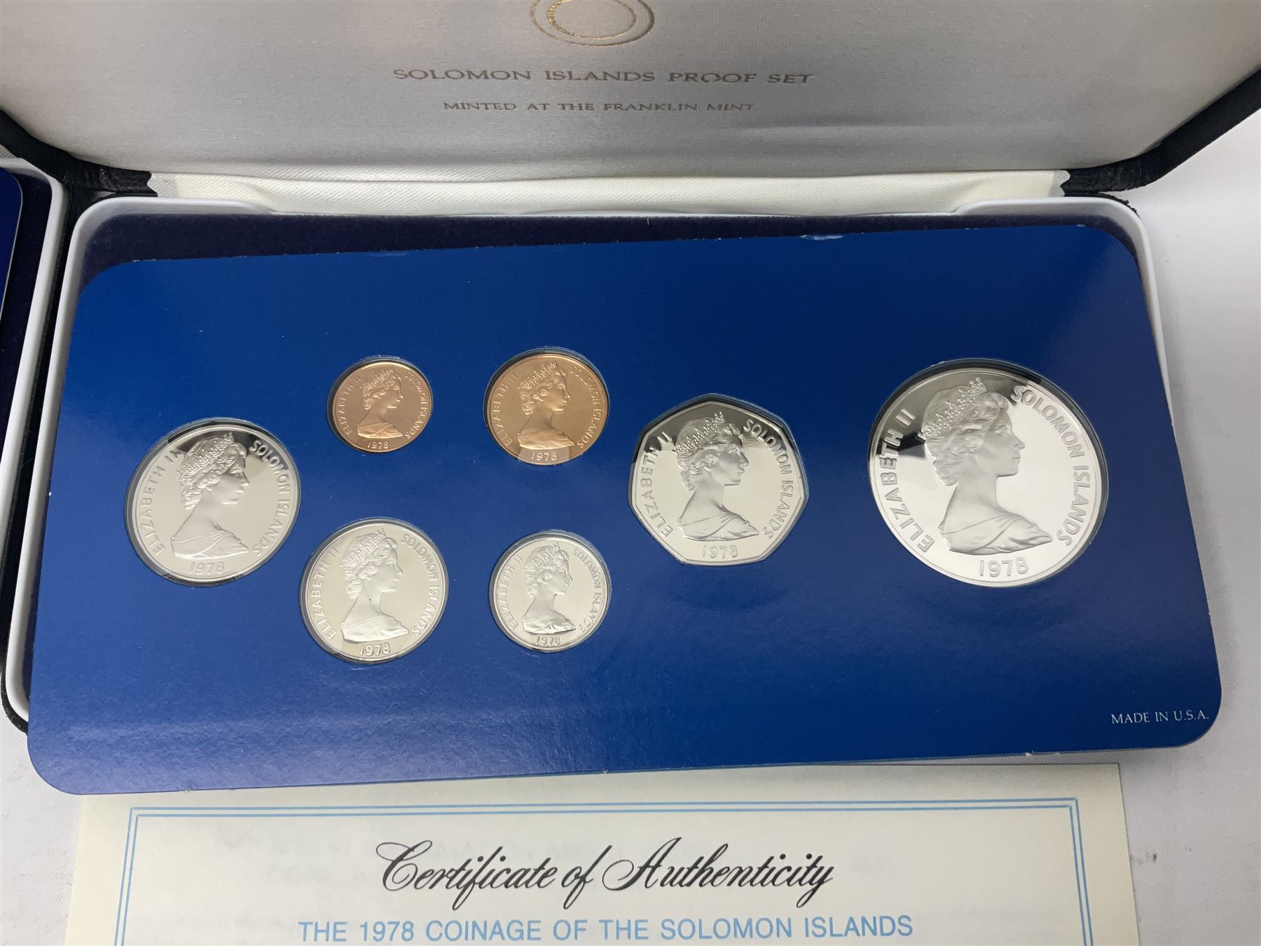 Four British Virgin Islands proof coin sets, comprising First Coinage of the British Virgin Islands 1973 proof six coin set, containing silver one dollar coin, 1977 and 1979 proof sets, containing high denomination silver coins, and The Royal Coronation Jubilee 1977 six coin silver proof set, each minted at the Franklin Mint, all cased with certificates, and a Solomon Islands 1978 proof seven coin set, containing silver five dollar coin, minted at the Franklin Mint, cased with certificate (5)