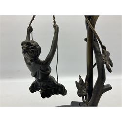 Art Nouveau style lamp in the form of a woman on a swing, with a green mottled shade, upon a marble base H52cm
