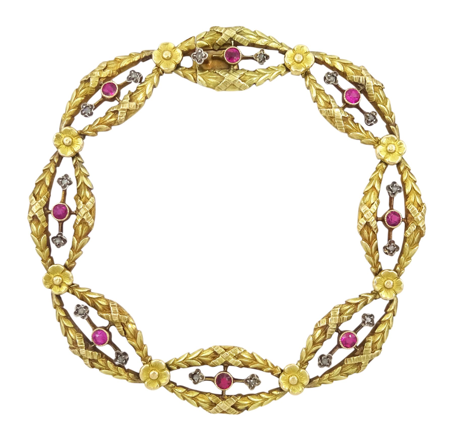 Late 19th / early 20th century French 18ct gold ruby and diamond fancy link bracelet, each laurel wreath link with a round cut ruby and two diamond chips either side and separated by a flower head, French horse's head hallmark