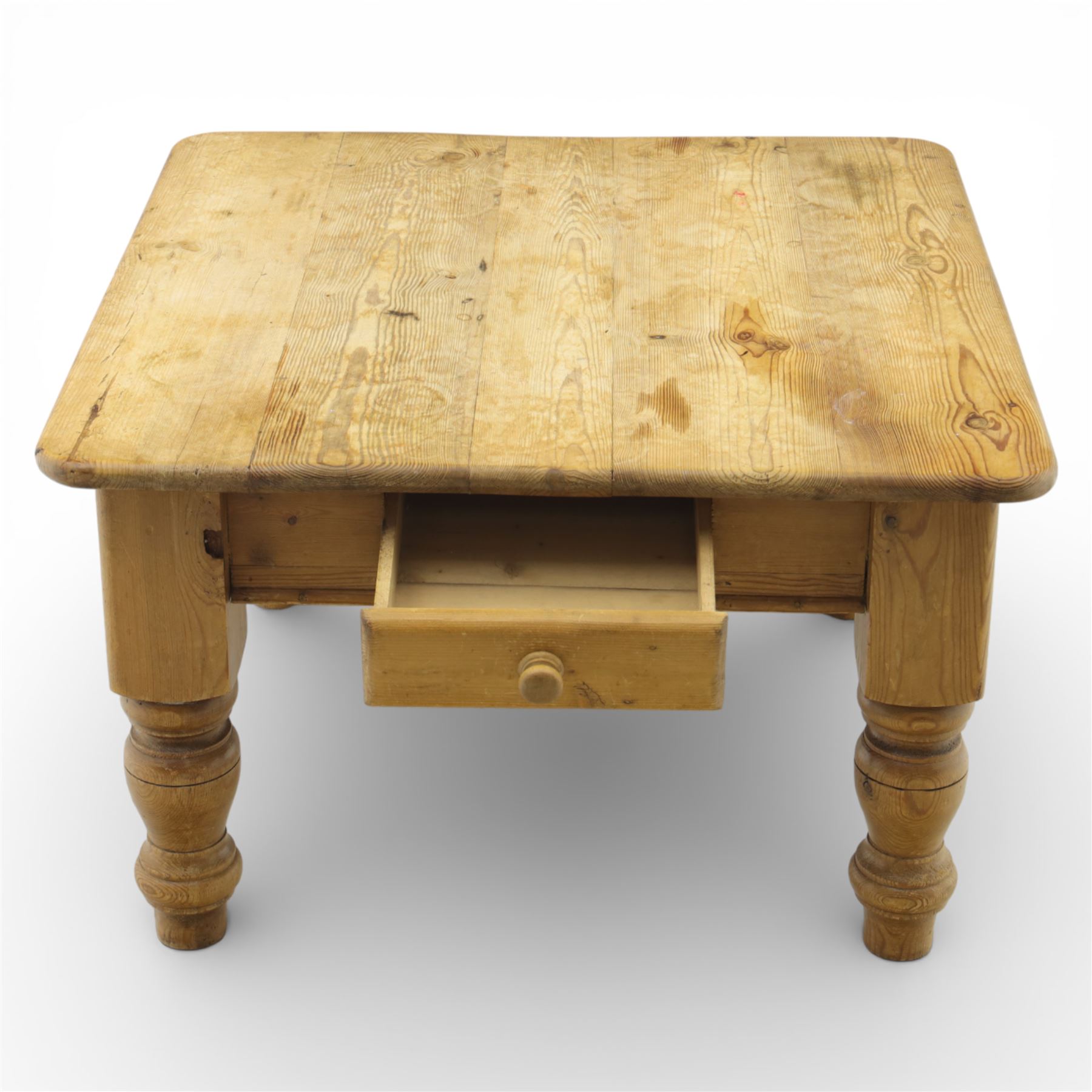 20th century stripped pine coffee table, square top over two frieze drawers, raised on block and turned supports