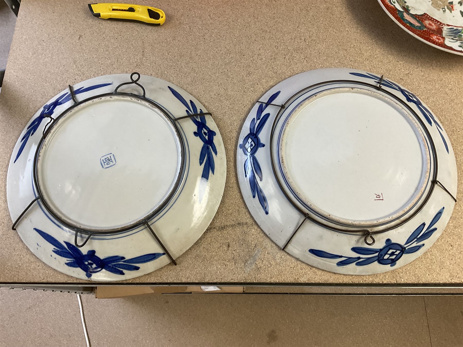 Two Japanese Imari chargers, decorated with reserves of flowers and birds, each approximately D36.5cm