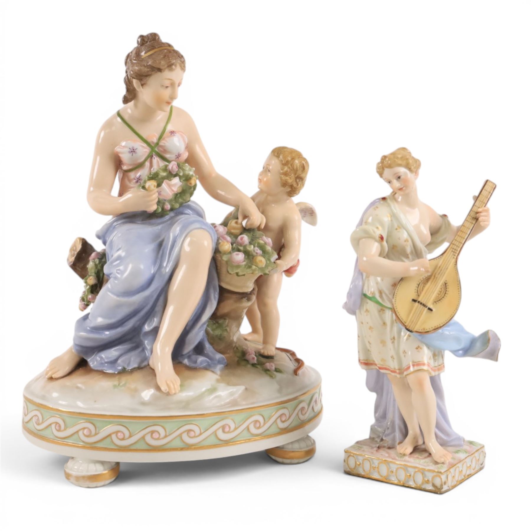 Karl Ens of Volkstedt figure group, modelled as a woman and cherub in a garden, with printed mark beneath, together with another figure modelled as a muse 