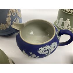 Collection of Wedgwood dark blue, light blue and sage green Jasperware, to include green bowl D20cm, green jug, covered trinket boxes, planters, urns etc