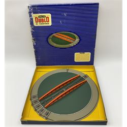 Hornby Dublo - six D1 accessories comprising Turntable; Through Station with white edges and separately boxed Platform Extension with Wall; Signal Cabin with orange roof and pack of station names; Level Crossing; and Island Platform; all boxed (6)