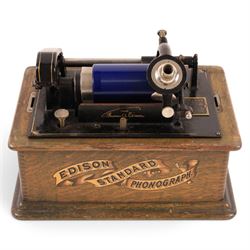 Early 20th century Edison Standard phonograph, in oak case, serial number S179930, together with a large brass phonograph horn and a collection of wax cylinders