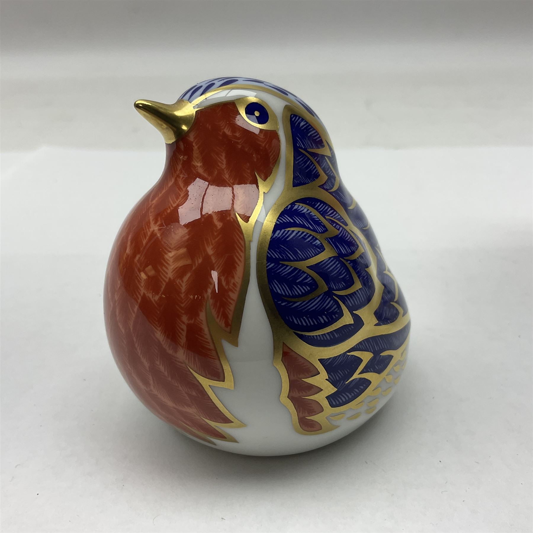 Two Royal Crown Derby paperweights, comprising Kingfisher, 2010 edition with gold stopper and Robin, with gold stopper