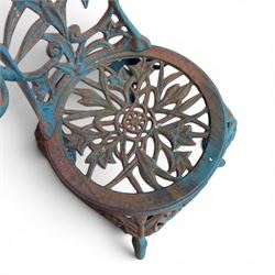 Cast iron garden table and four chairs, in the Art Nouveau style, with pierced floral and foliate decoration throughout, circular table raised on four cabriole legs with stretcher ring, chairs with shaped openwork backs and seats, in a weathered green finish