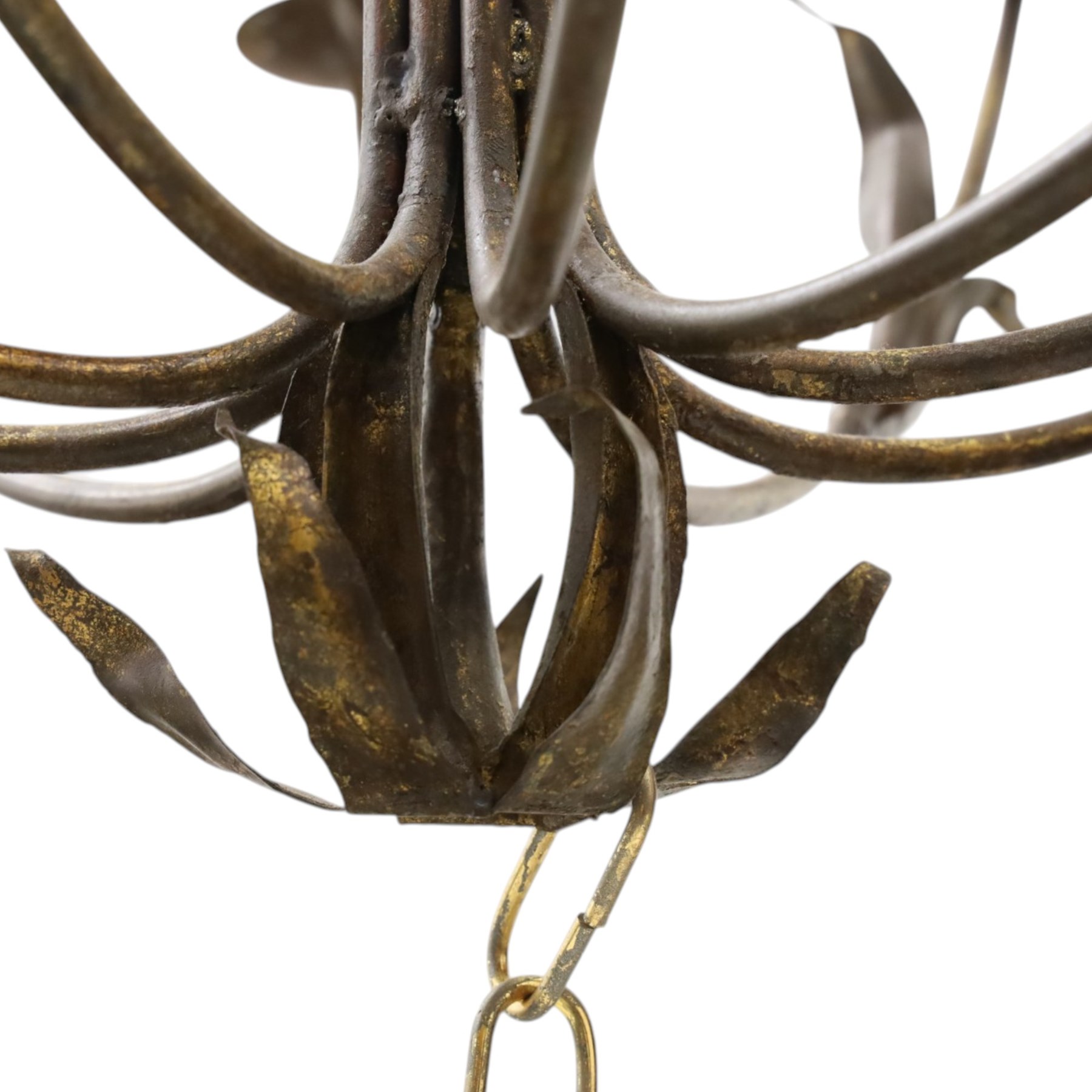 Early 20th century wrought iron and gilt metal twelve-light candle chandelier, with scrolling branches, stylised leaf decoration and chain suspension