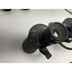Pair of British World War Two issue black-painted binoculars, Bino 7x50 No. 5, 6E/320, No. 87412, MoD.B/42, with case, together with Nipole 10 x 50 binoculars and two other pairs