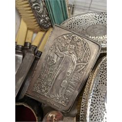 Group of silver, comprising four silver mounted clothes brushes, bible cover, glass bottle with silver lid, five stainless steel ivorine handled knives with silver ferrules, hallmarked and silver plated items