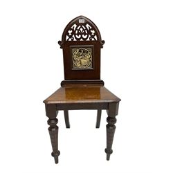 19th century oak hall chair, arch shaped back with pierced and carved scroll foliate design, inset minton tile designed by John Moyr Smith depicting Alfred, raised on ring turned tapering supports