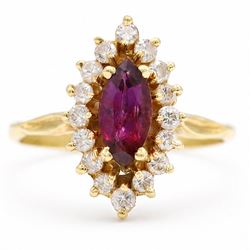 18ct gold ruby and diamond cluster ring, single marquise cut ruby of approx 0.90 carat, su...