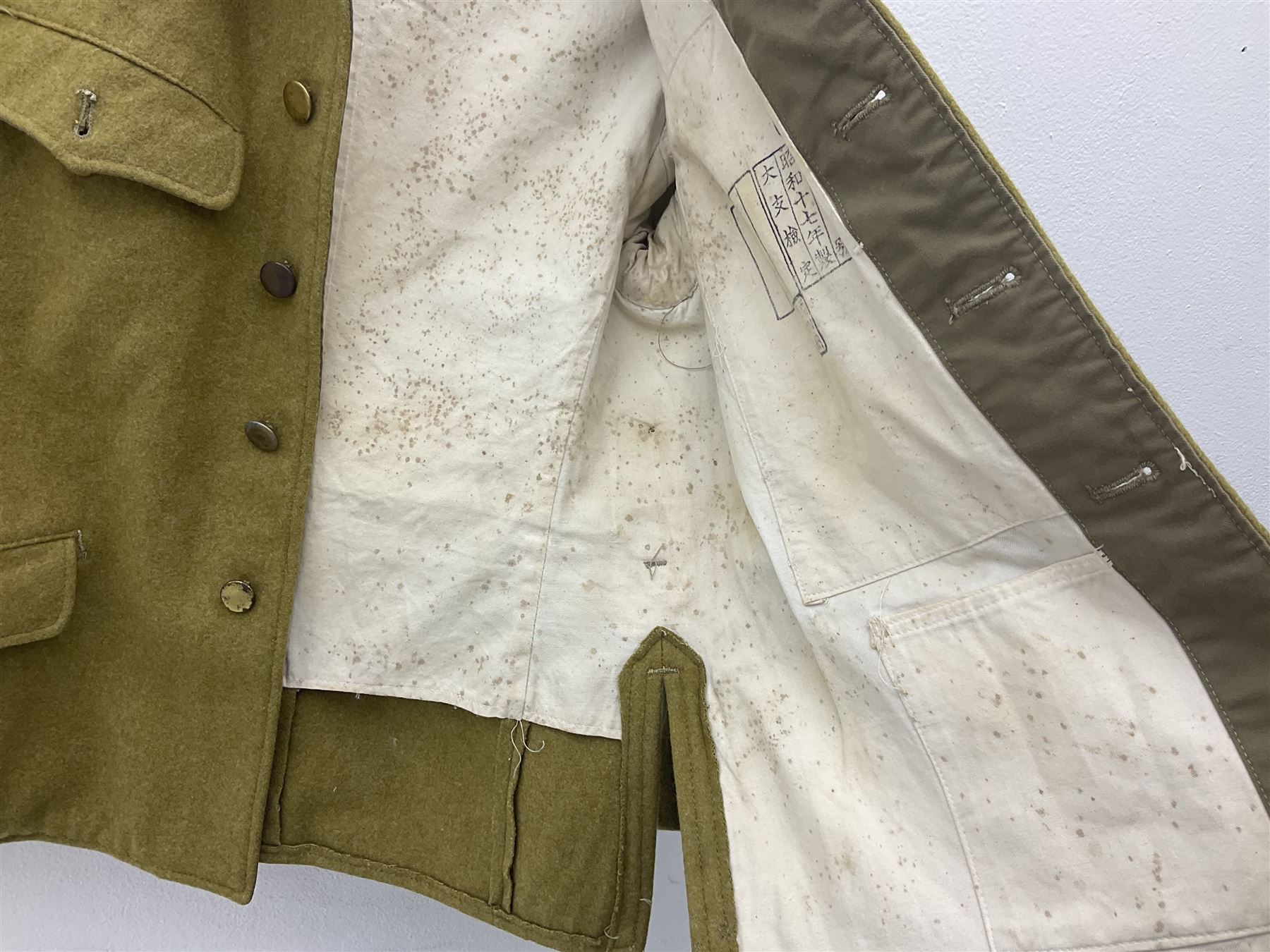 Japanese Type 38 winter tunic, the lining stamped with various Japanese character marks