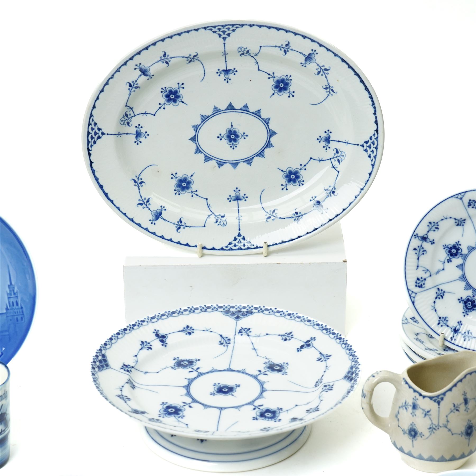 Royal Copenhagen onion pattern low comport, three breakfast cups and five saucers, oval platter, four tea plates, Munich 1972 Olympics plate, and four other blue and white items