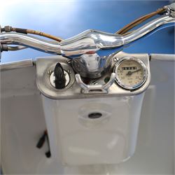 1957 Zündapp Bella R154 Scooter

• Registration: 150 KPU
• Year: 1957
• Model: Bella R154
• Engine: 150cc two-stroke single-cylinder petrol
• Transmission: Four-speed manual
• Odometer reading: 1,727 miles
• Colour: Ivory
• Seating: Dual seat
• V5C: Present
• Original registration book: Present
• Keys: 1

A characterful 1957 Zündapp Bella R154 scooter, finished in ivory with a contrasting brown dual seat and displaying an odometer reading of 1,727 miles.

The Bella R154 formed part of Zündapp’s distinctive range of German touring scooters, combining a 150cc air-cooled two-stroke engine with four-speed transmission, large wheels and substantial pressed-steel bodywork. This example retains its enclosed front apron, central headlamp, chrome handlebars, brightwork, period VDO speedometer and decorative Bella badging.

An operation and maintenance manual is include and accompanied by its V5C and original registration book from 1957.

This vehicle forms part of the Estate of the Late John Sills and is offered for sale by the Executors, confirming a genuine reason for sale.