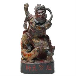 19th century Chinese carved and painted wooden figure of a deity, possibly a triumphant de...