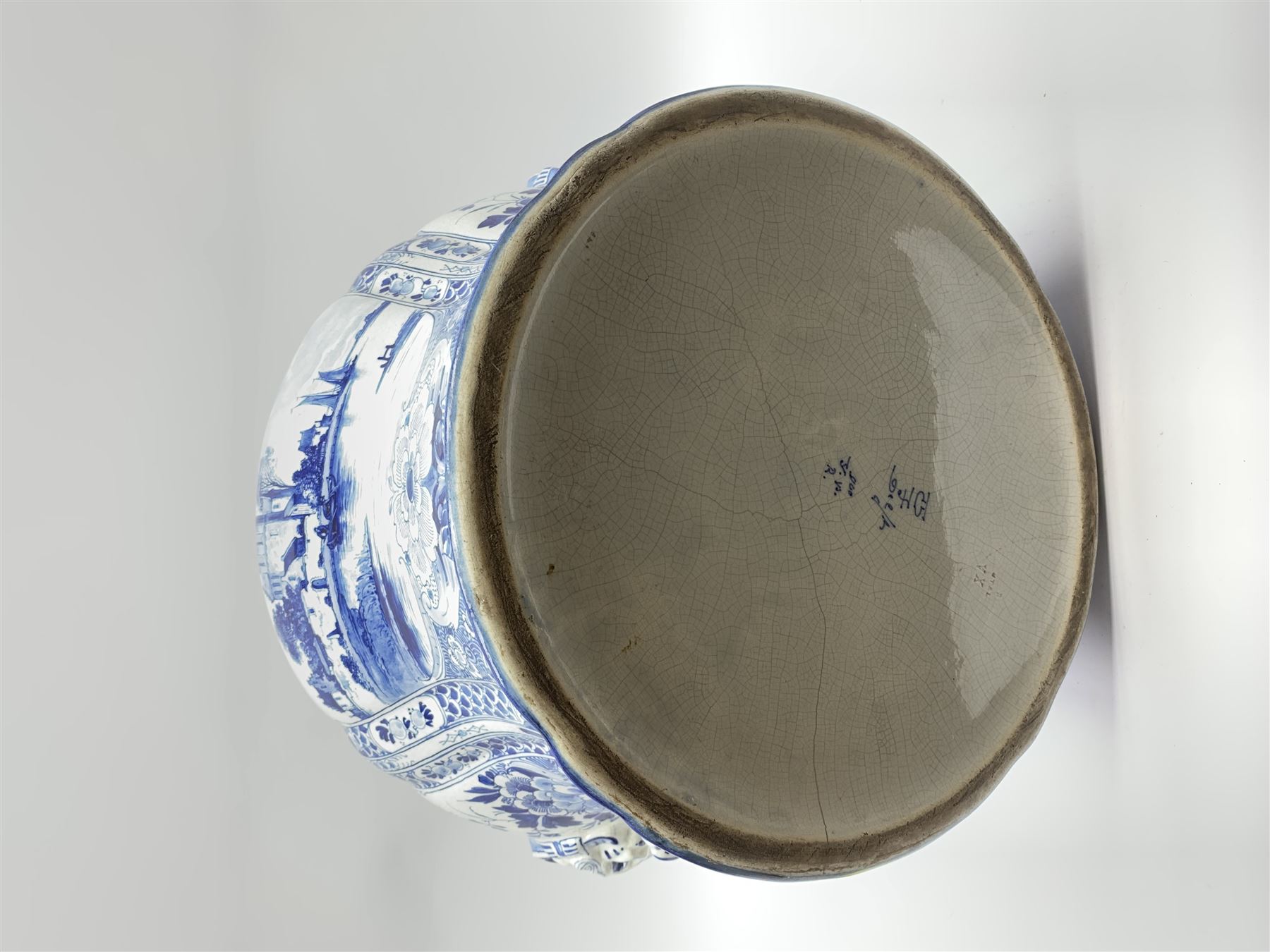 Large 20th century Delft blue and white jardinière, of baluster form with twin zoomorphic mask lug handles, decorated with hand painted panels of waterside scenes, within foliate surround, impressed and painted marks beneath for De Porceleyne Fles workshop, Delft, H35cm, rim D32