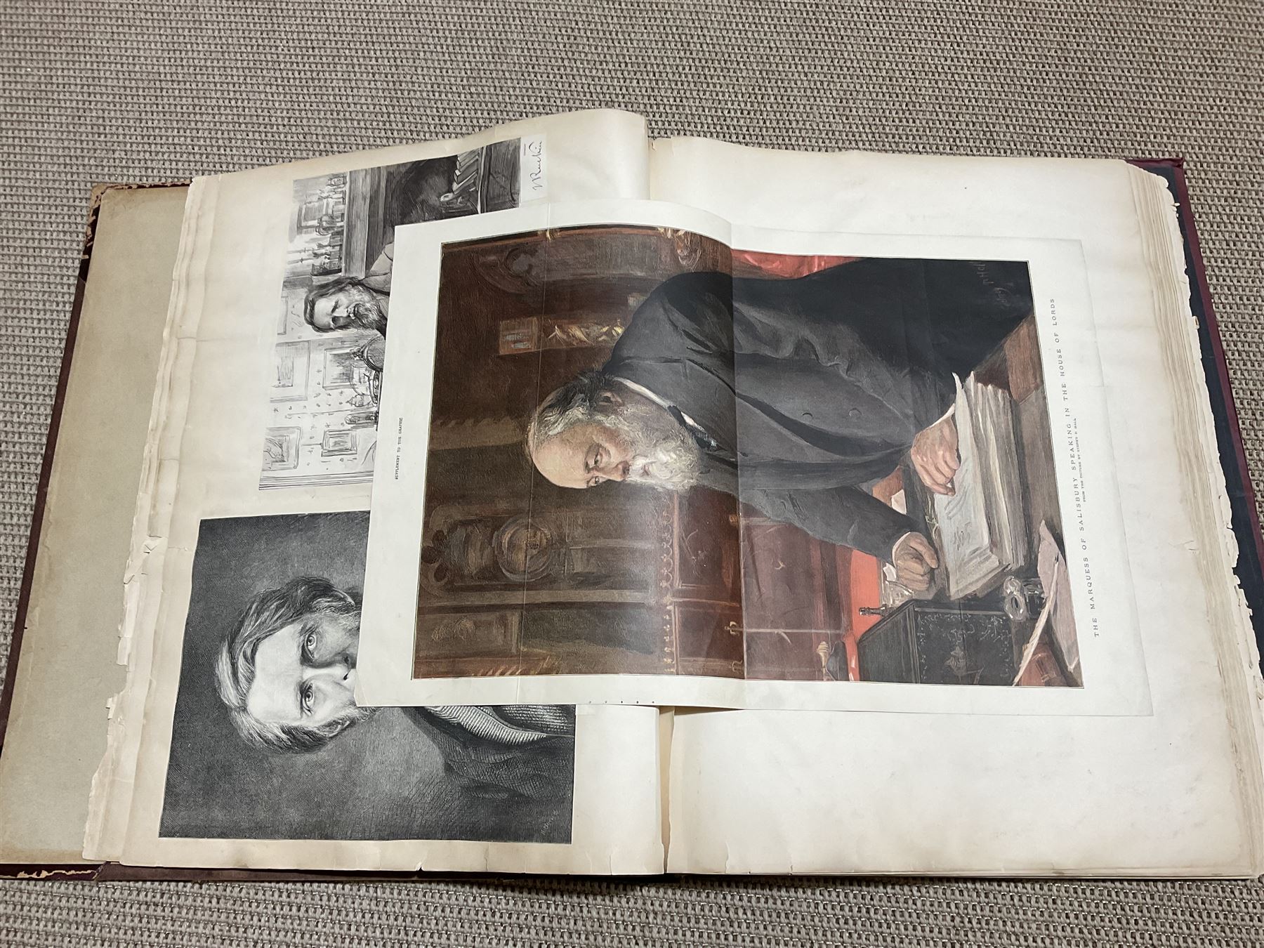 Large album of 19th century and later engravings and prints, mostly military, stuck down, album 49cm x 62cm overall