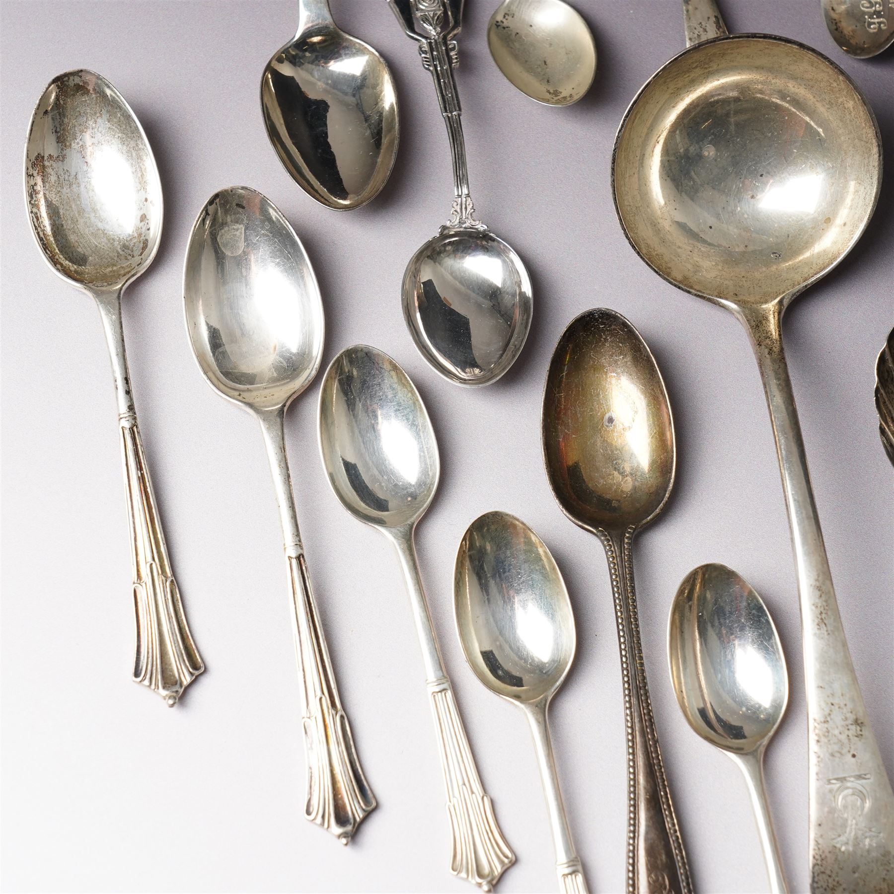 Quantity of assorted silver cutlery including sauce ladle, Victorian caddy spoon, various teaspoons, golf club spoons etc