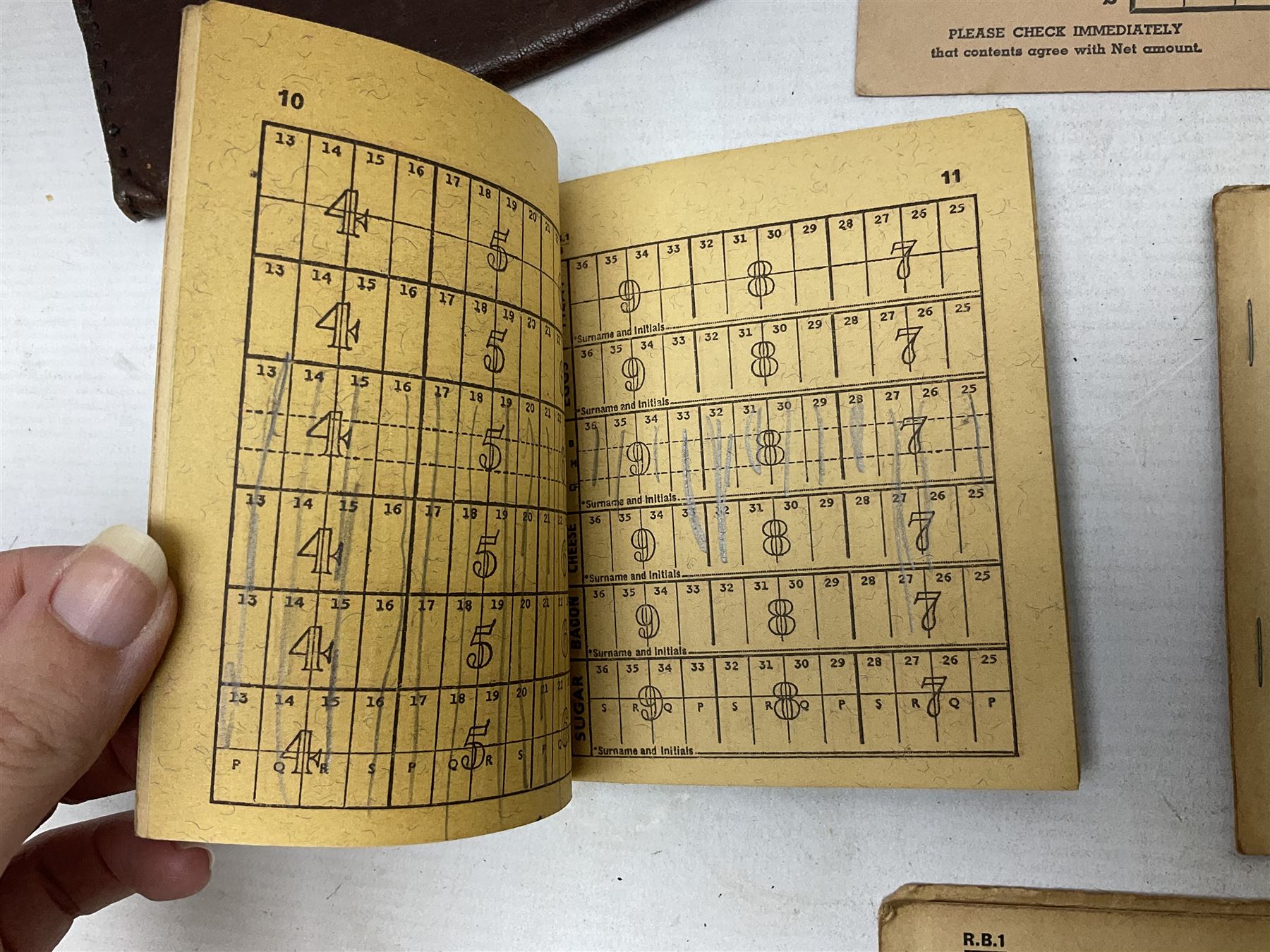 Gold plated leaping Jaguar car mascot, no.7'24265'3WB L12.5cm; three AA car badges and Veteran Motorists car badge; and quantity of 1950s fuel and general ration books