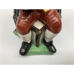 Early 20th century Staffordshire William Kent Squire toby jug, modelled seated upon a corner chair holding a jug of ale in his right hand, H28cm