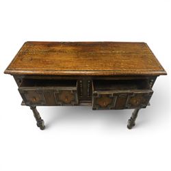 Georgian oak dresser base, plank top above an arrangement of two fielded panel drawers with moulded geometric fronts, on turned front supports and block rear legs