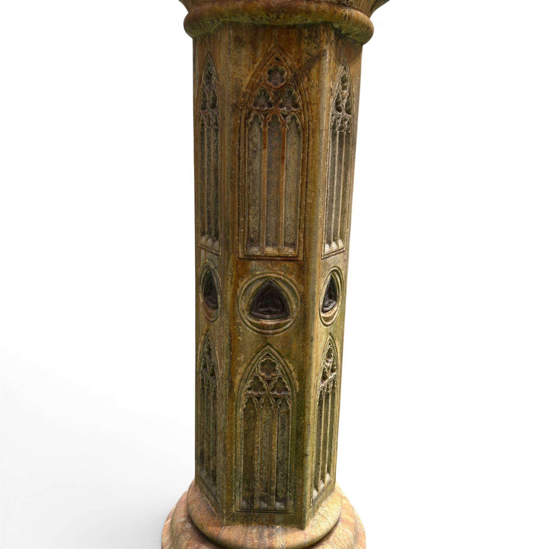 Farran stone garden statue depicting a hooded monk standing in flowing robes in circular form, set upon Gothic pedestal with arched panels, featuring lead hands and script band