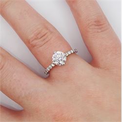 Platinum single stone round brilliant cut diamond ring, with diamond set shoulders and diamond set gallery, principal diamond approx 1.00 carat