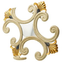 Rococo design gilt and painted wall mirror, the central mirror plate surrounded by an elaborate openwork frame of scrolling C-scrolls and volutes, decorated with gilt shell motifs and contrasting black painted details