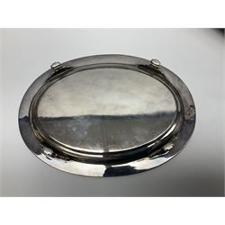 Pair of Mappin and Webb silver plate pierced pedestal bon bon dishes, together with other silver plate comprising teapot stand engraved with lion's head to centre, two cut glass claret jugs, two bottle coasters with acorn decoration, two open salts upon dolphin mounts, tea caddy, three piece cruet set and a large oval tray with pierced sides and upon four ball feet