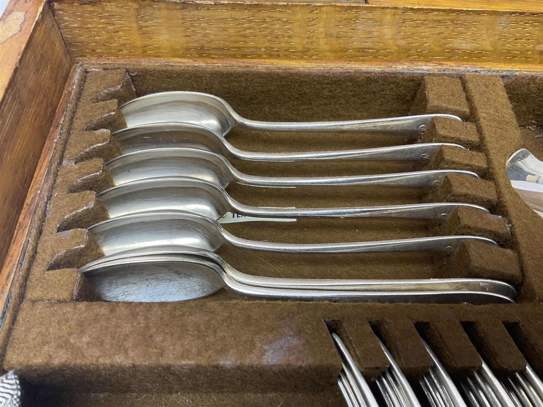 Mappin & Webb silver plated canteen of cutlery, the oak case with hinged lid two two removable trays, and sunken brass handles, H19cm, L52cm