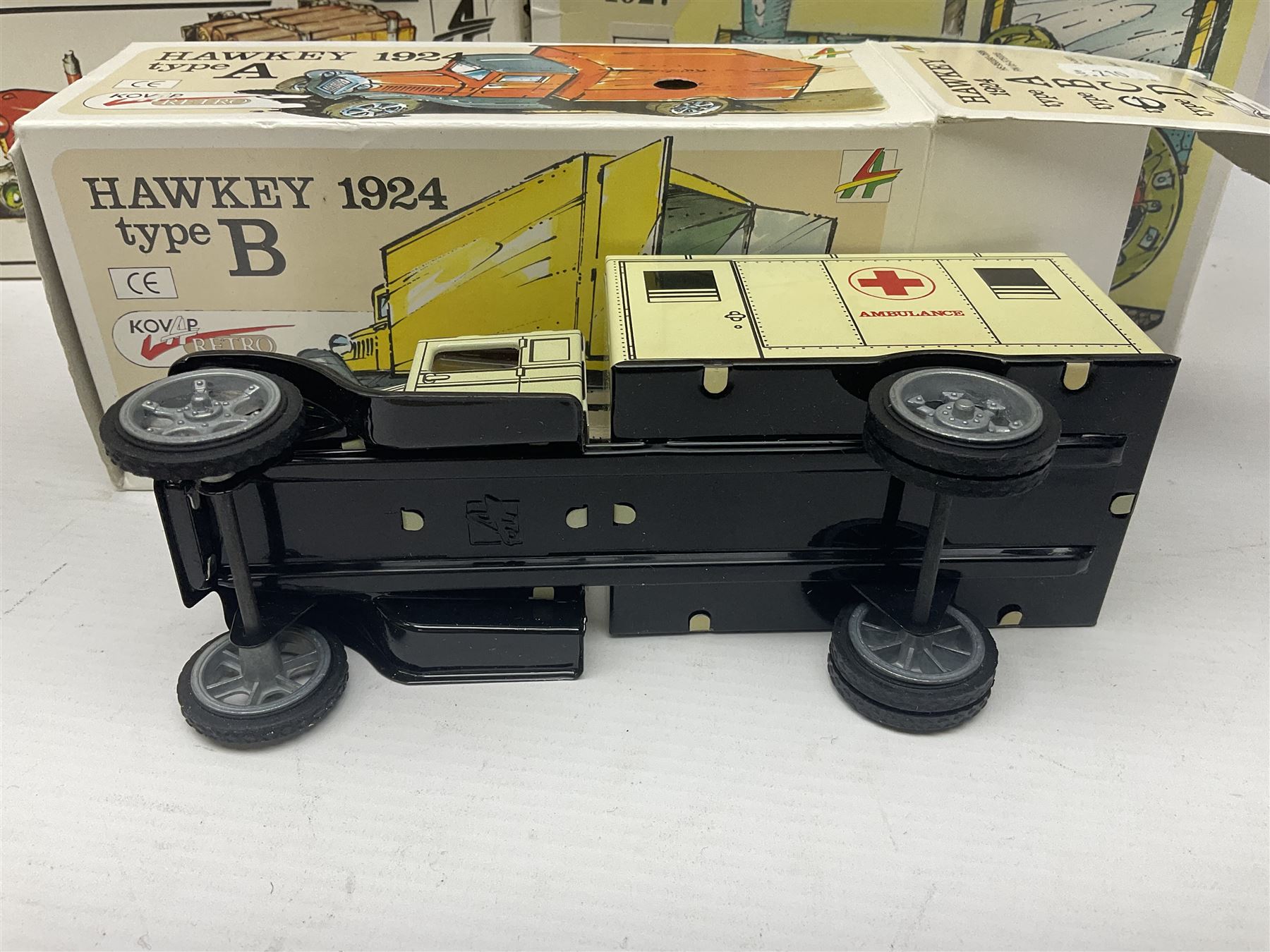 Kovap - eleven tinplate models to include Tractor and Trailer, Road Roller 1927, Moving Moneybox 1924, Hawkeye type B 1924, Boy on a Tricycle; all in original boxes 