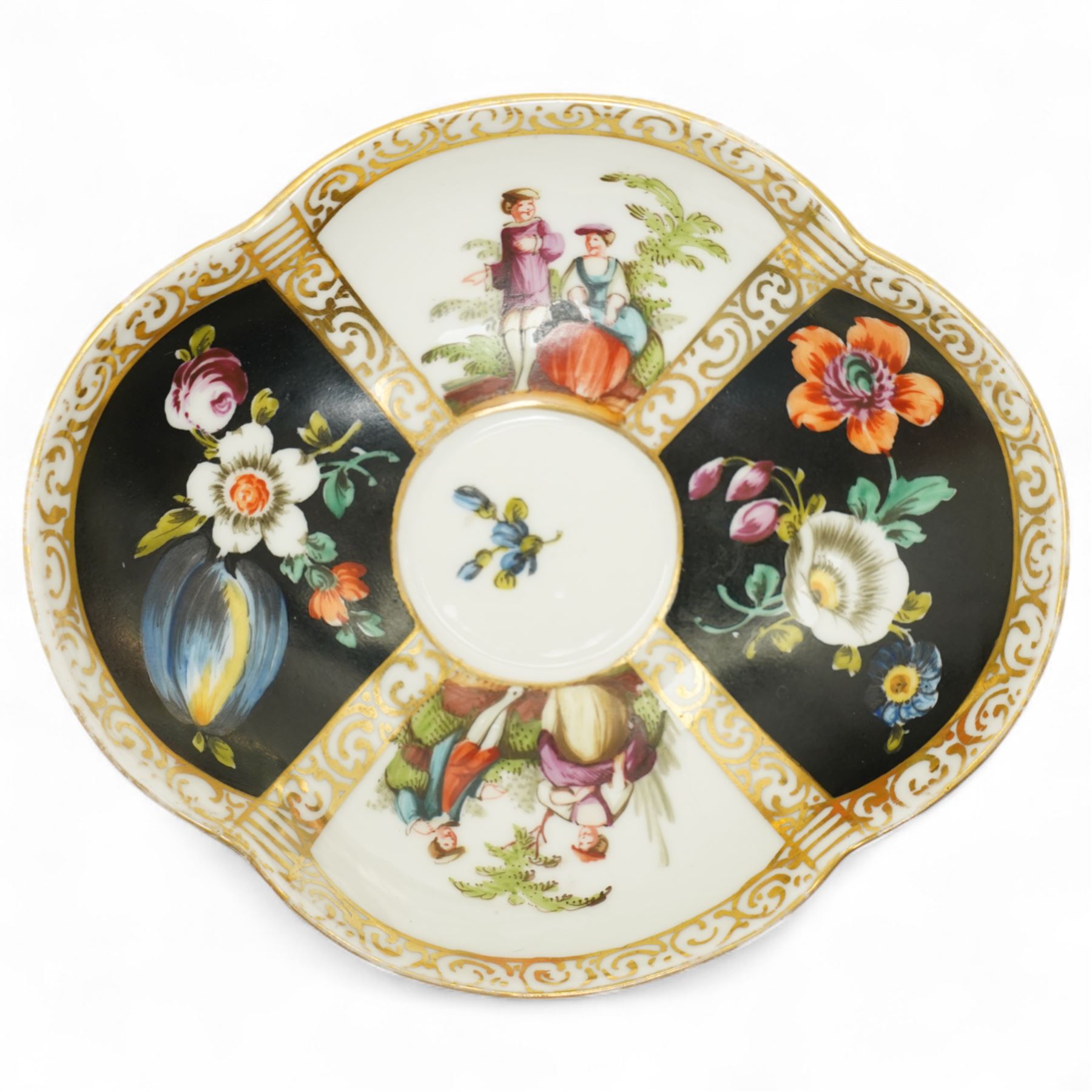 Helena Wolfsohn Dresden porcelain quatrefoil teacup and saucer, decorated with panels of figures and floral sprays on a black ground, marked to base, together with a flask with painted scene of travellers in a port, indistinct continental mark to base, flask H12cm