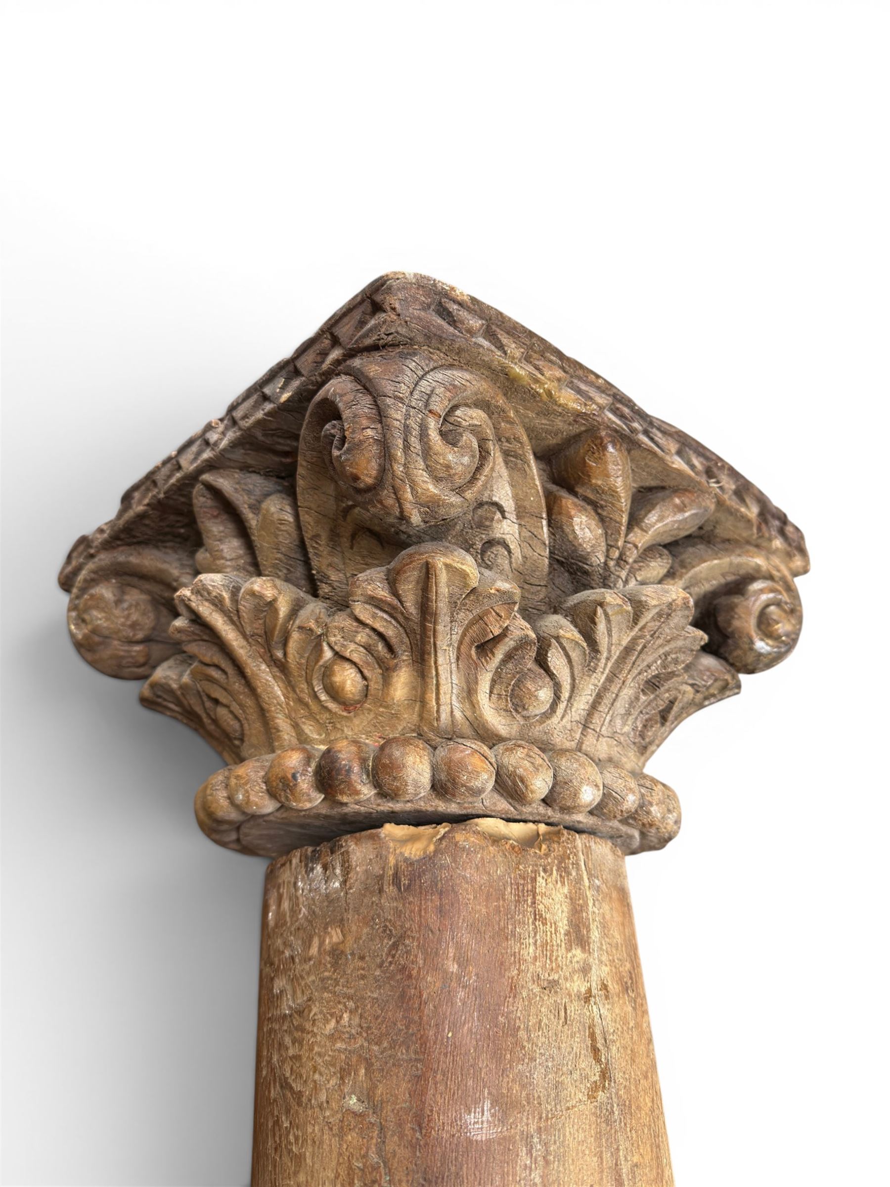 Matched pair of 19th century hardwood architectural columns with carved capitols, column diameter 18cm