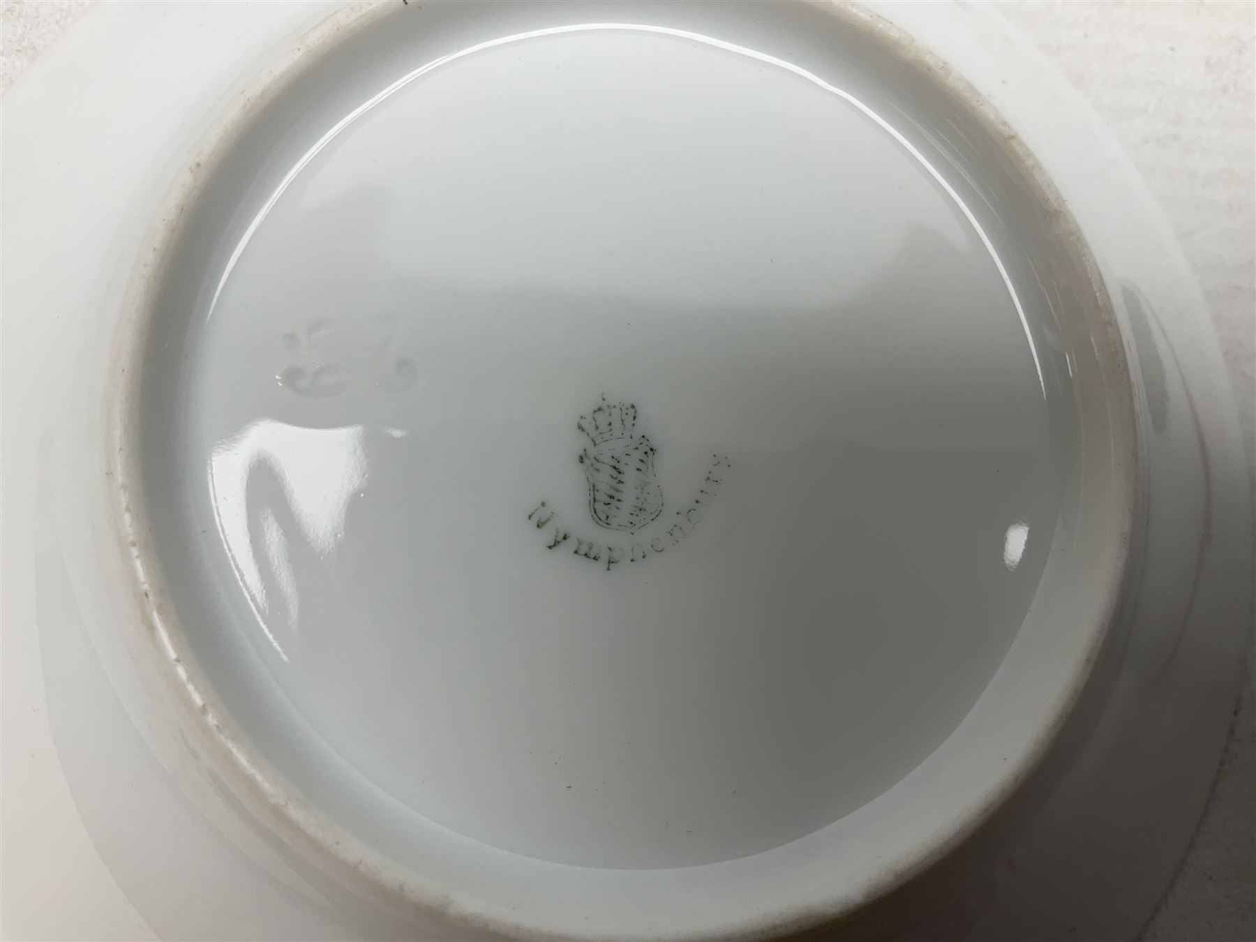 WW2 Nymphenburg cups and saucer, decorated with Imperial German Iron Cross encircled in a foliate boarder with gilt edging, with printed mark beneath 
