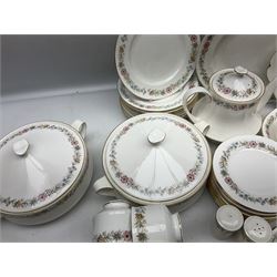 Royal Albert Paragon tea and dinner service for twelve decorated in the Belinda pattern, comprising fourteen saucers, twelve teacups, thirteen side plates, teapot, sauce boat and stand, salt and pepper shakers, two jugs, sucrier, twelve dinner plates, twelve smaller plates, two lidded tureens, twelve bowls, twelve smaller bowls, cake plate, oval plate and oval dish (100)