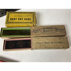 Tinplate magic lantern with three boxes and some loose slides, including Primus magic lantern slides