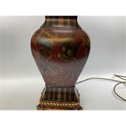 Pair Oriental table lamps decorated with birds in a tree with fruit, on a red ground with a gilded base together with cream lampshades H57cm, without lampshade. 