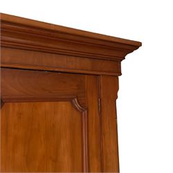 Victorian mahogany wardrobe, projecting moulded cornice over plain frieze, central mirror flanked by two panelled doors, the interior fitted with hooks and hanging rails, on moulded plinth base