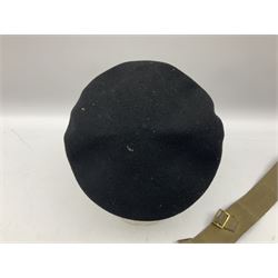 WW2 British black felt beret with Pioneer Corps cap badge, with Kangol Wear maker's mark dated 1943; and a British Army green webbing belt (2)