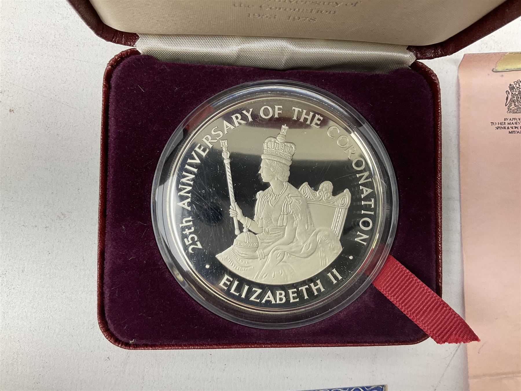 Jamaica 1975 eight coin proof set produced by the Franklin Mint and a Jamaica 1978 sterling silver proof twenty-five dollar coin, both cased with certificates