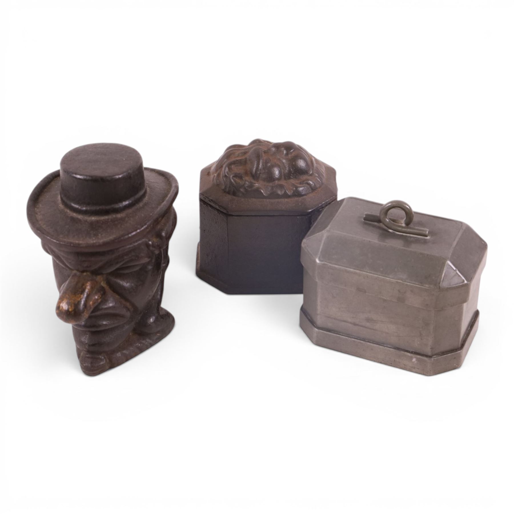 Collection of 19th century and later tobacco jars, including two lead examples, caster iron punch and two others 