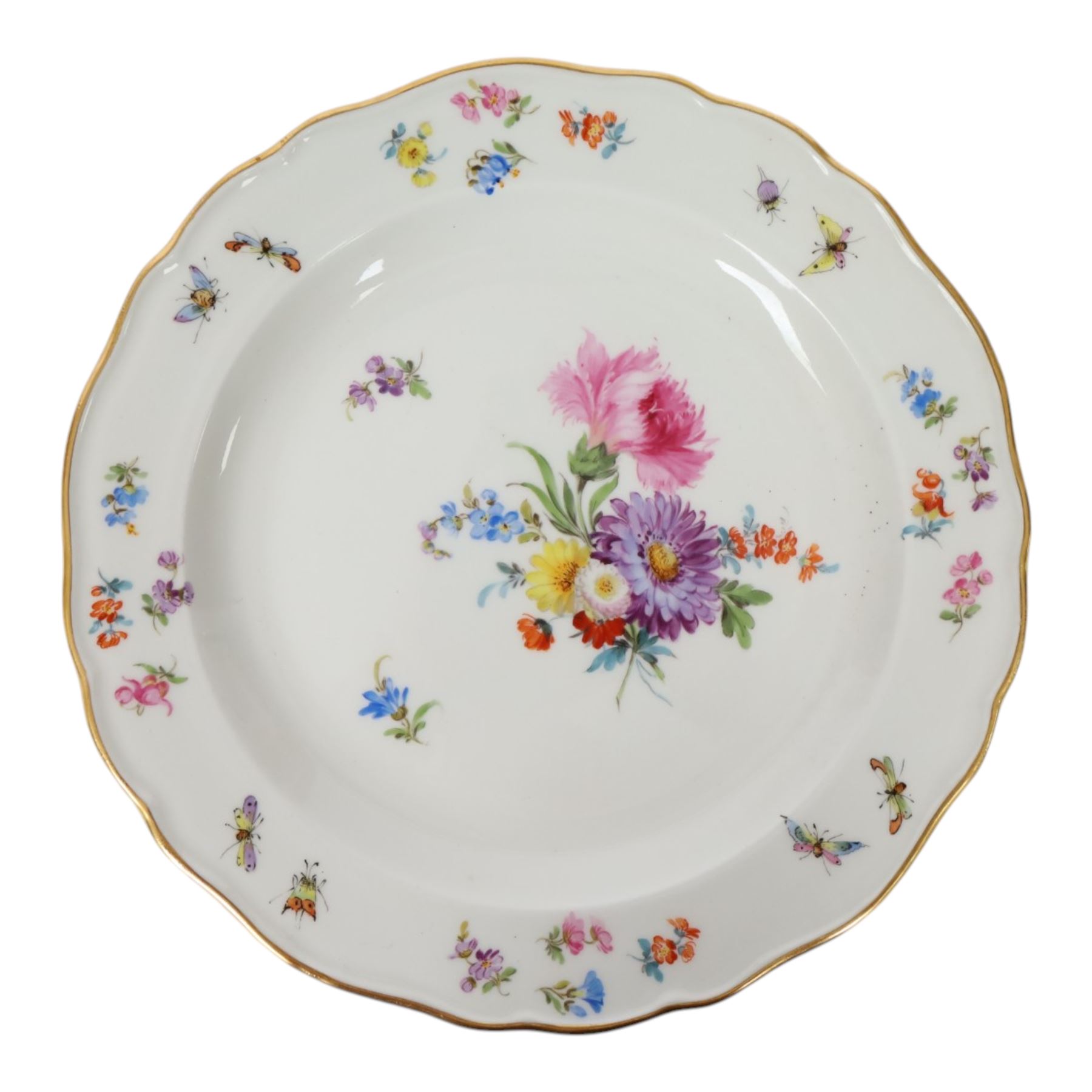 Four early 20th Century Meissen plates, hand painted with floral sprays, sprigs and inspects, with underglaze blue cross sword mark beneath, D21.5cm