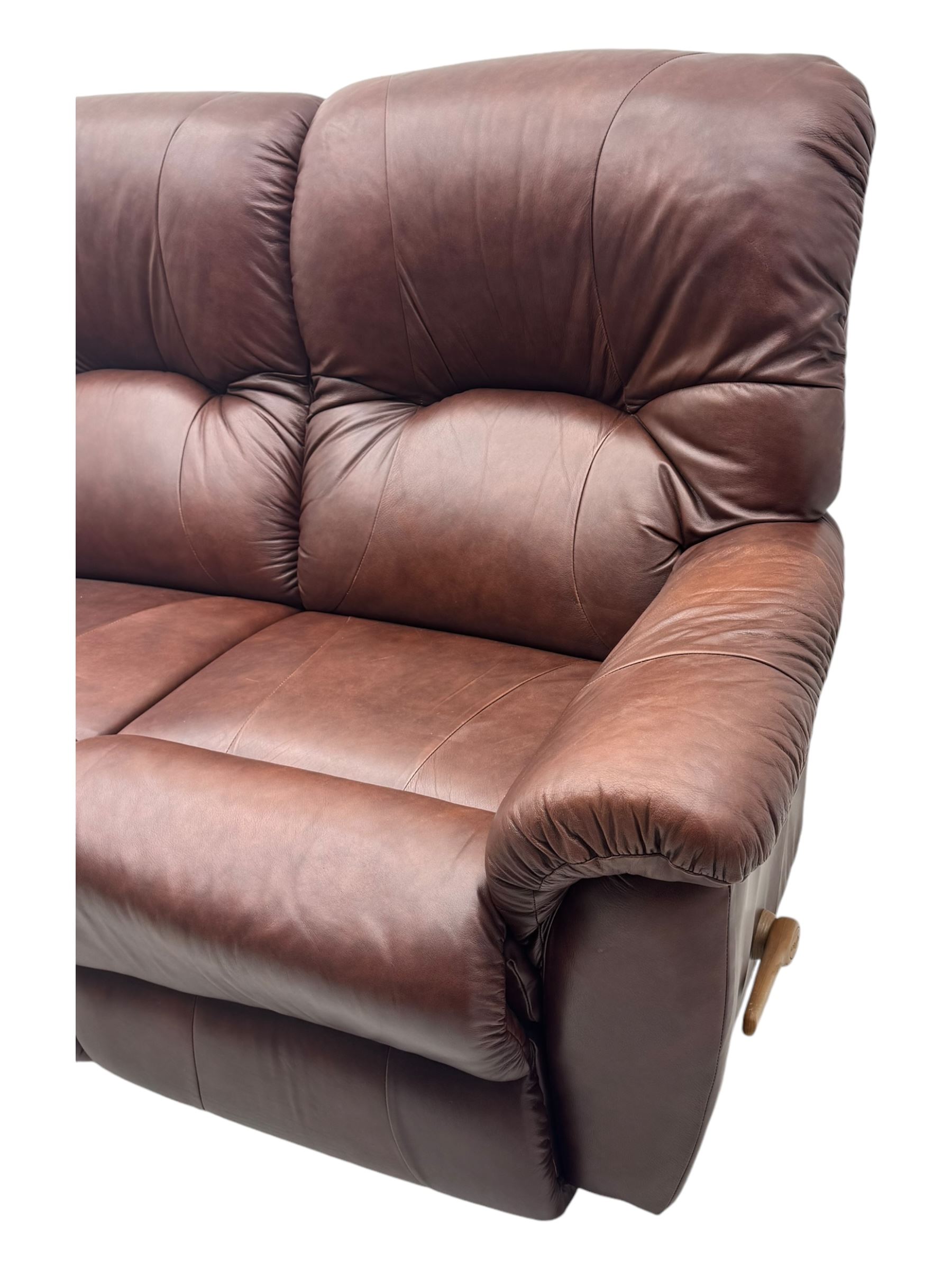 La-Z-Boy - manual reclining three piece suite - two seater sofa (W165cm, H105cm); and two armchairs (W98cm), upholstered in brown leatherette