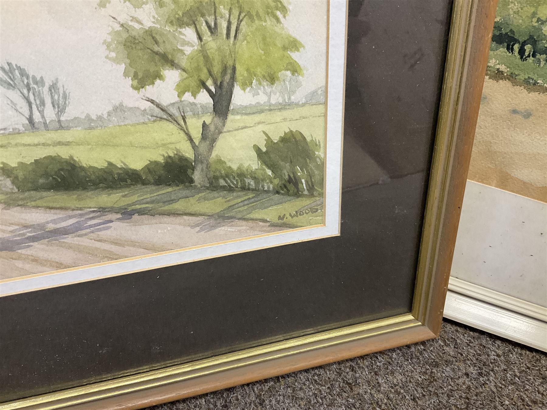 G A Townsend (British 20th century) 'The Trout Inn', watercolor signed and dated; M C W (British 20th century) The Wolds watercolor signed and dates, together with another watercolour and three landscape prints