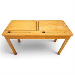 Mid-20th century beech double school desk, twin hinged desk-top compartments with inset pen and ink tray, on square supports