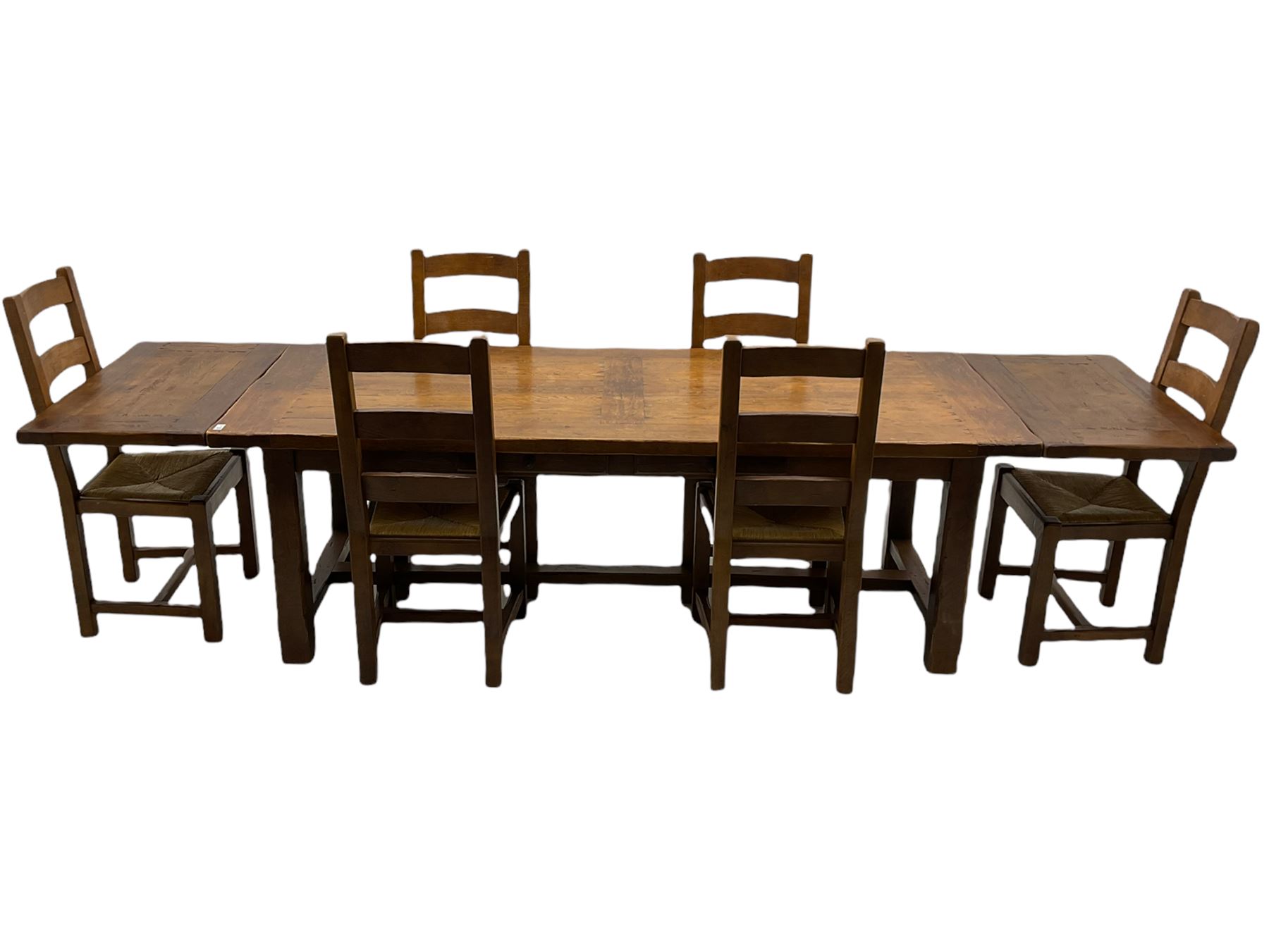Antix French oak dining table with two leaves, two frieze drawers;, and six ladder back chairs with rush seats
