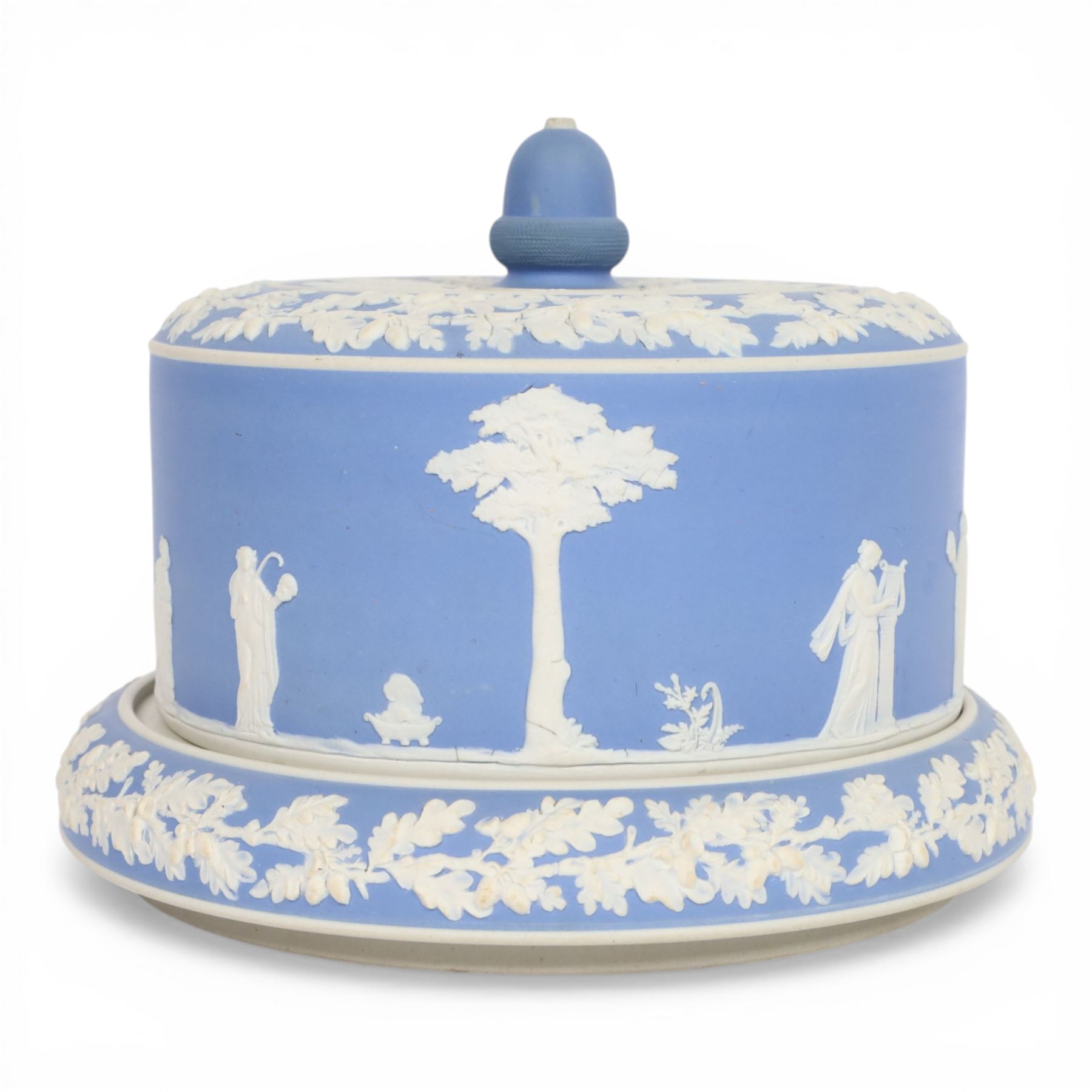 19th century Jasperware cheese dome decorated with classical figures in relief, with borders of oak leaves, with acorn finial, H22cm