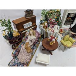 Dolls house furniture, including pianos, fireplace, plants, flower arrangements, tables, chairs, six figures and a collection of instruments and other accessories